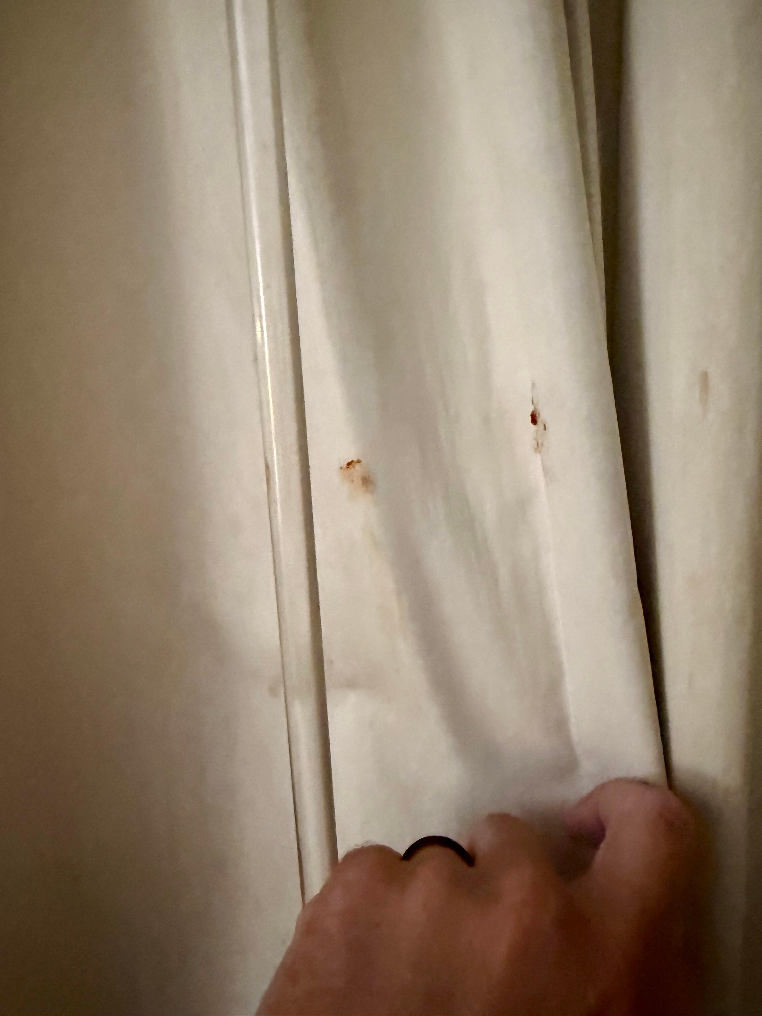 Blood on curtains.
