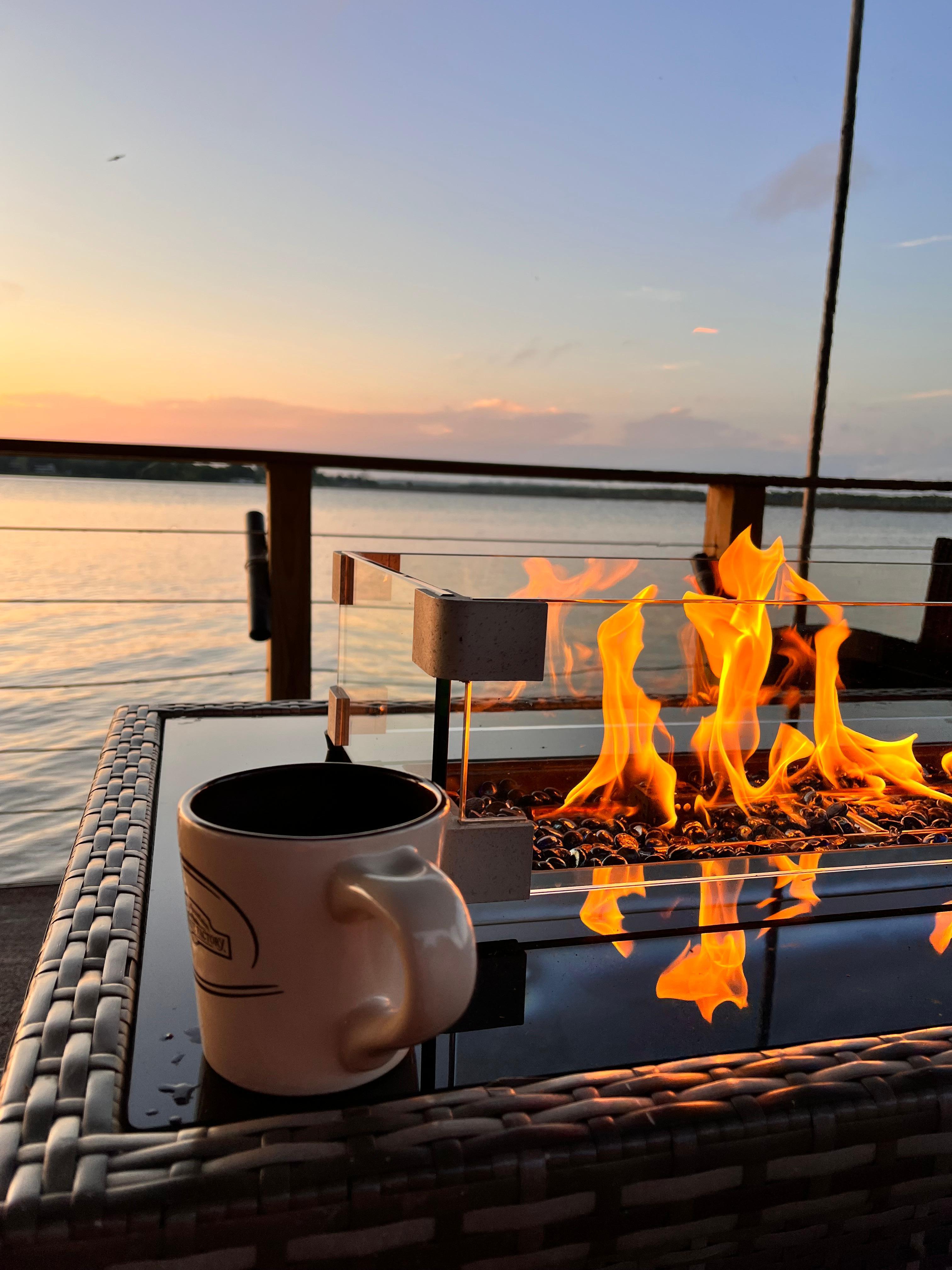 Watching the sunrise drinking a fresh cup of good ole joe (she had a bean grinder)