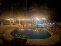Beautiful evening view of the pool and backyard