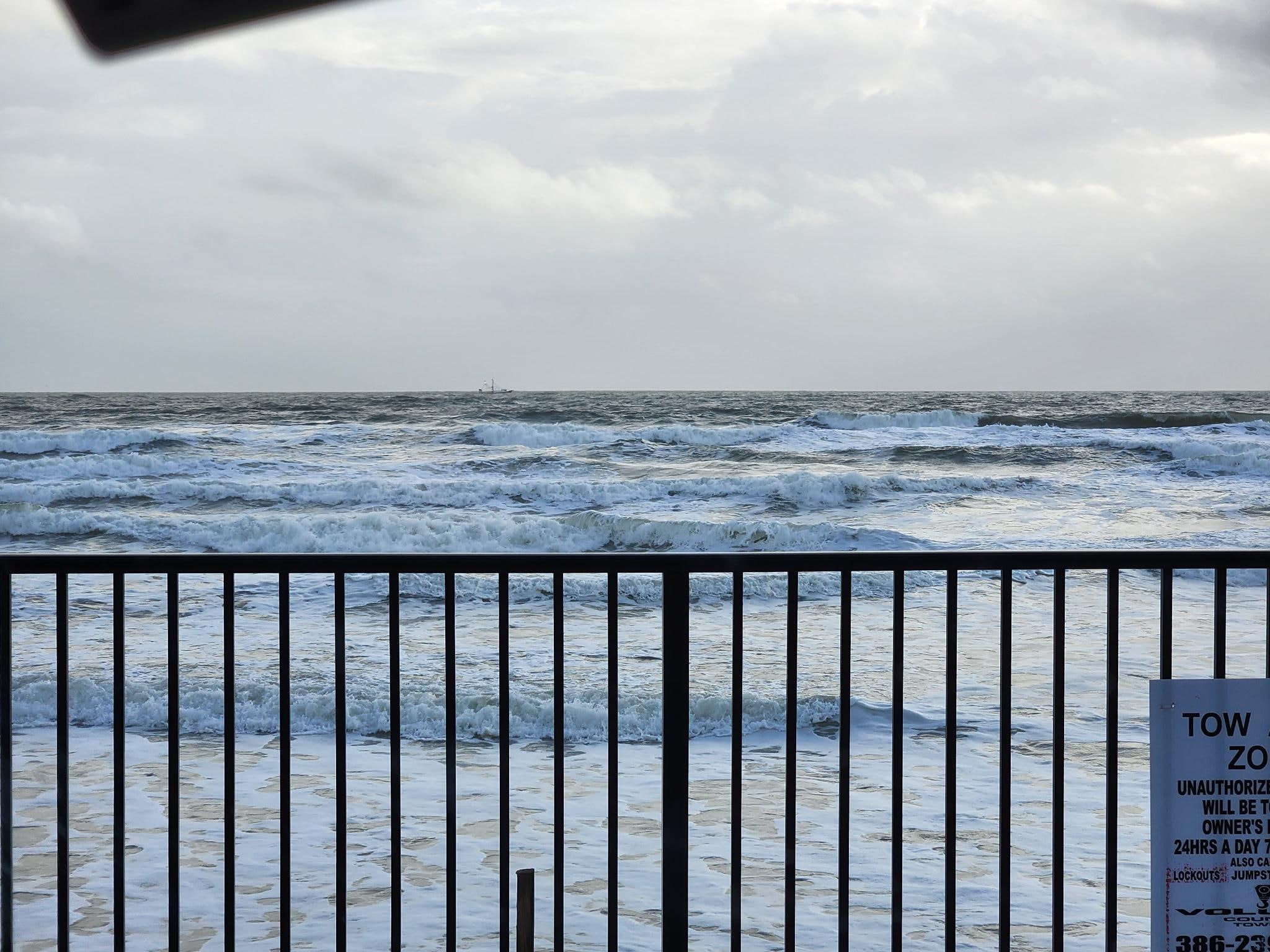 Condo breezeway view of ocean and beach.