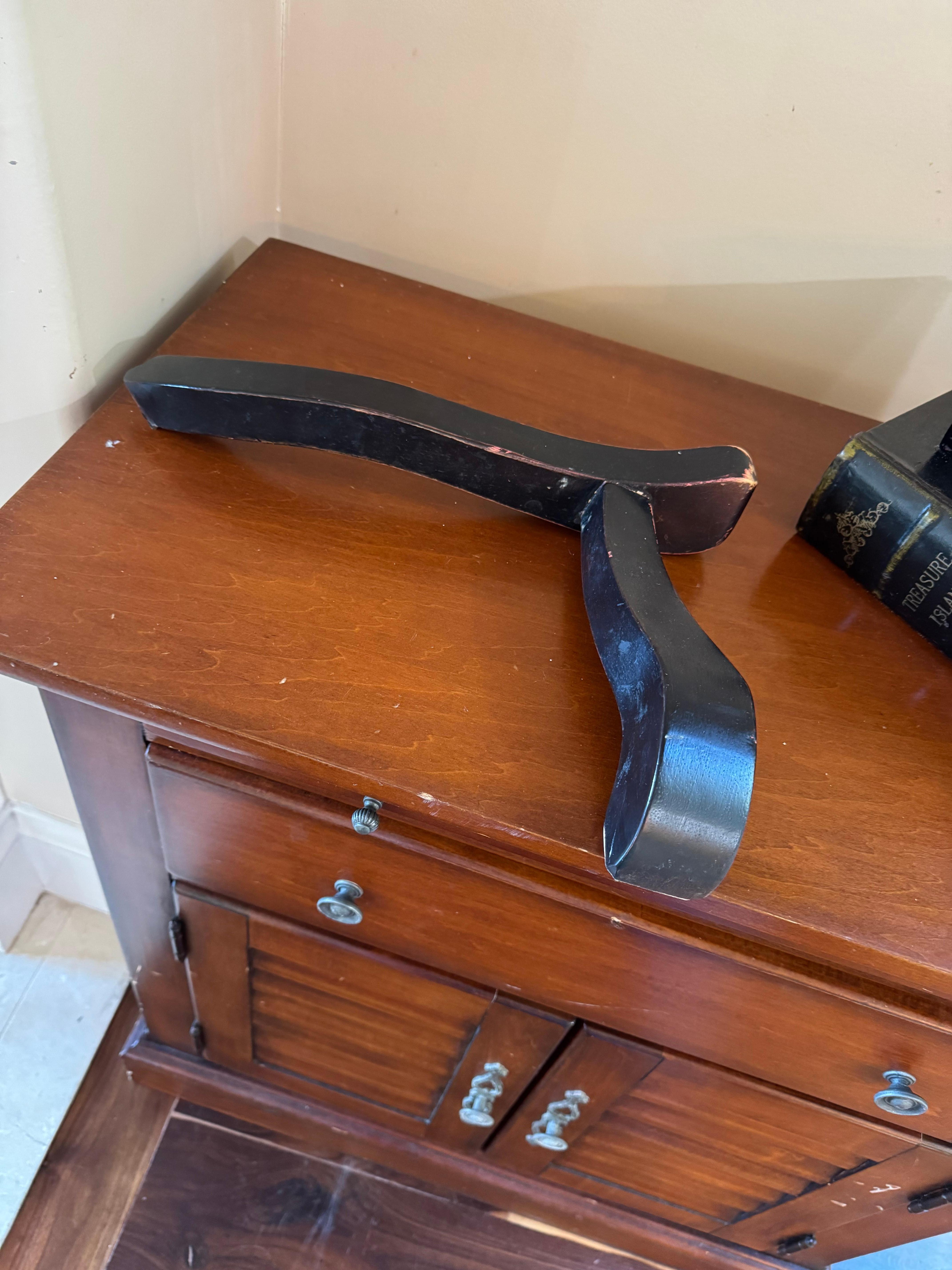 Arm from chair across the room