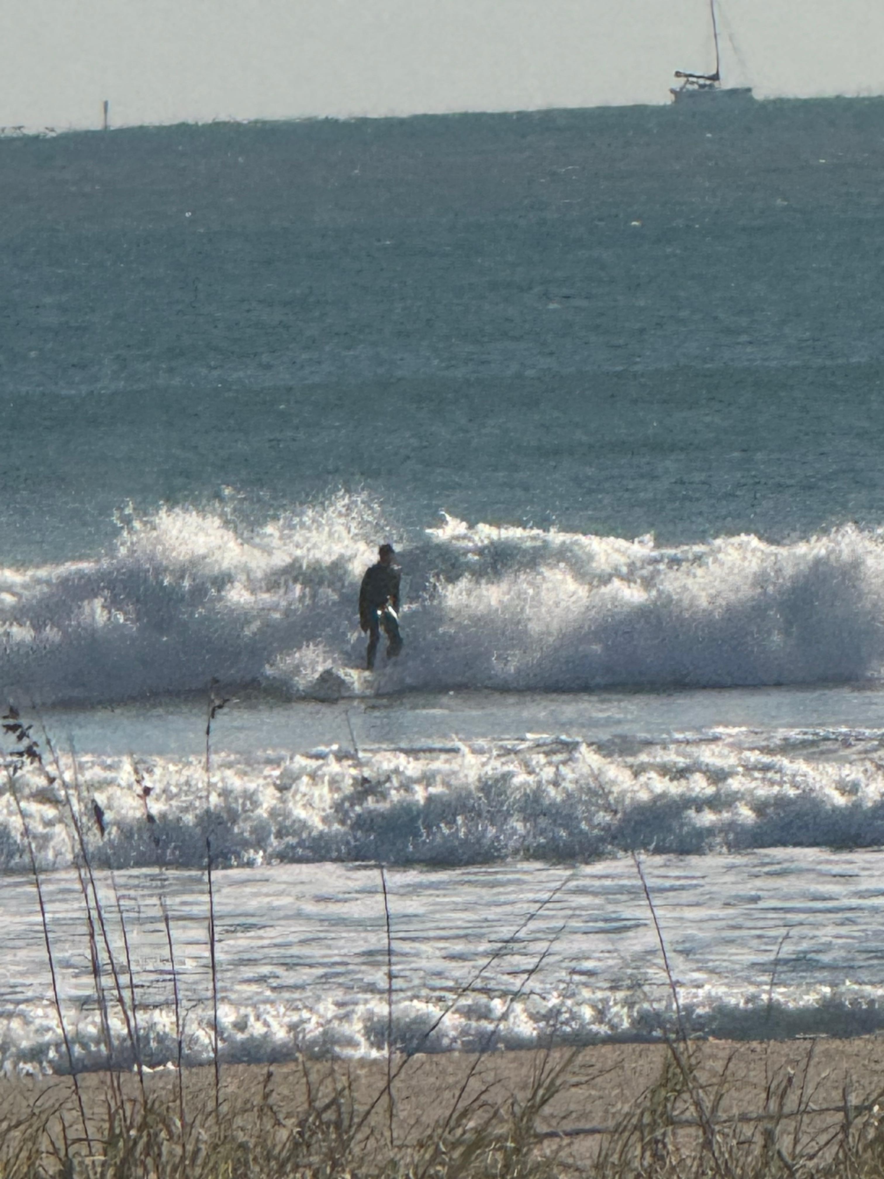 Surfer hitting the waves