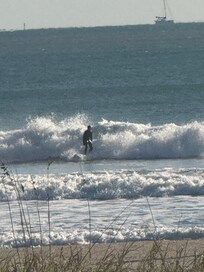 Surfer hitting the waves