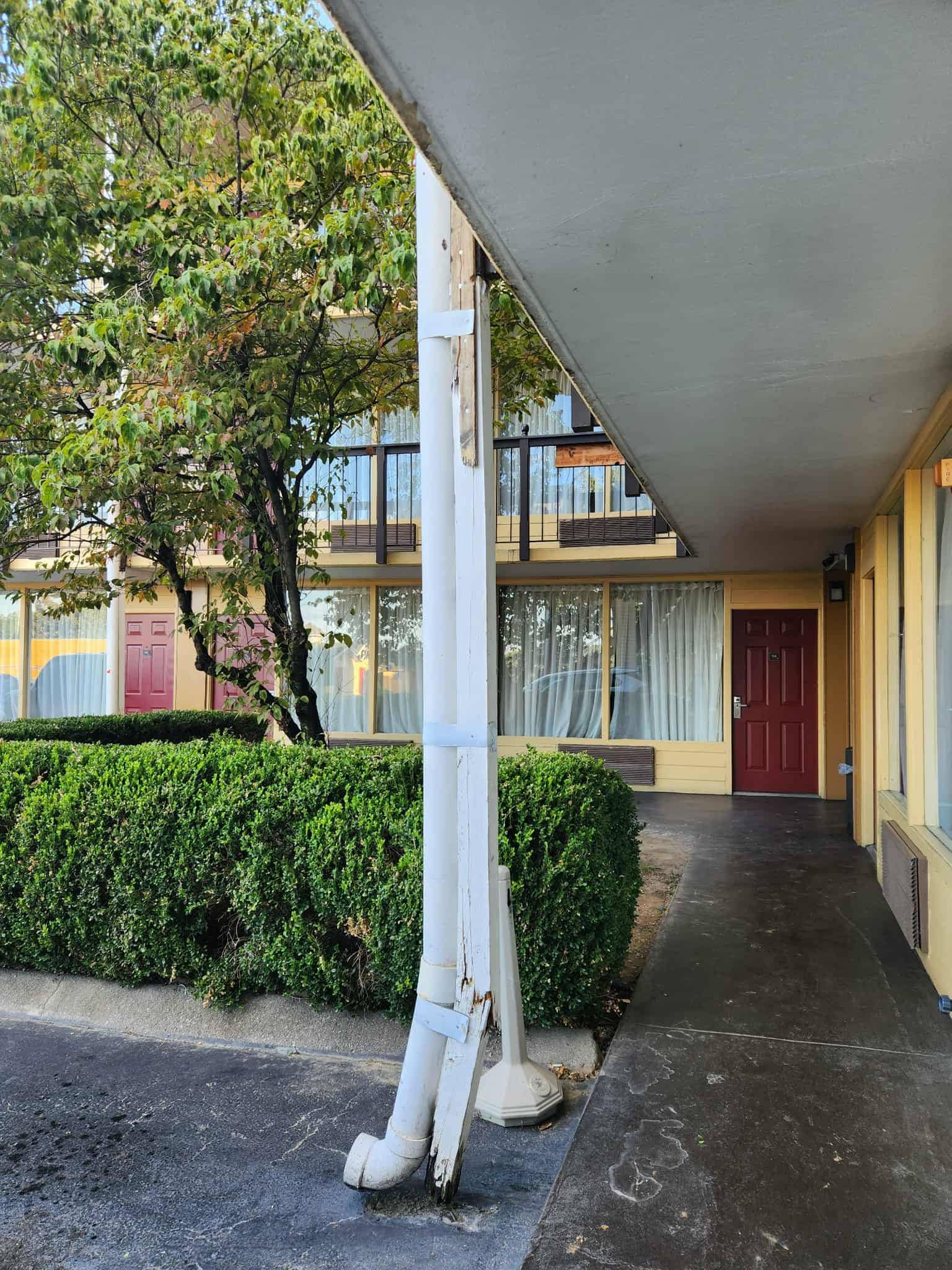 Support beam broken, held together with strips of wood and thin metal bands. 