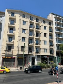 This is the building and the entrance is the black door between the Indian restaurant and the InstaCar business.