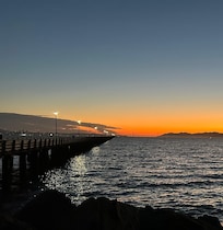 A sunset view of the Golden Gate Bridge from the Berkeley Marina.
