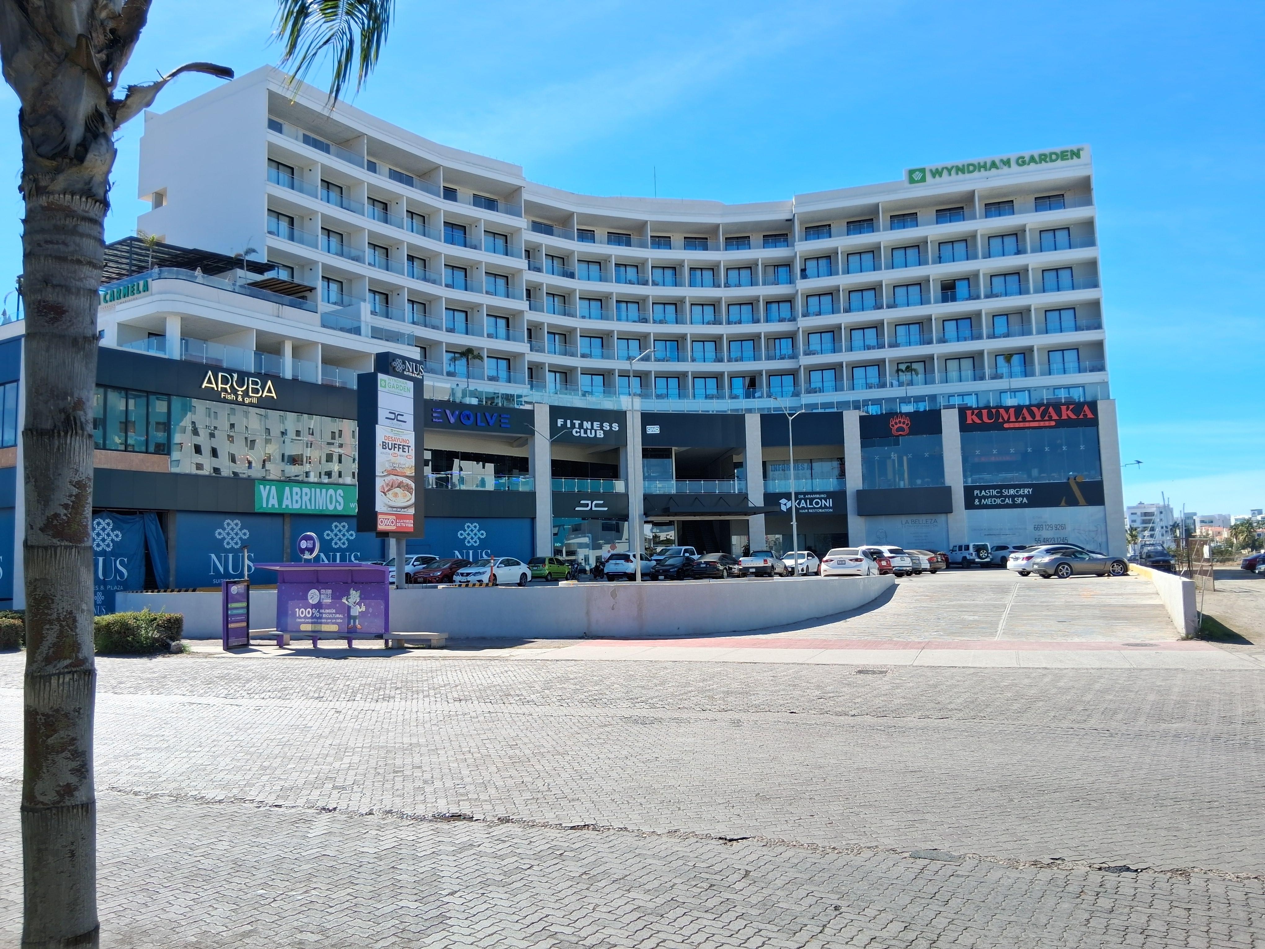 Compare these real hotel pictures taken by me with the AI generated ones on their website. Note there is NO body of water in front of hotel all. Must be AI generated fake for their website