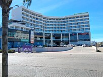 Compare these real hotel pictures taken by me with the AI generated ones on their website. Note there is NO body of water in front of hotel all. Must be AI generated fake for their website