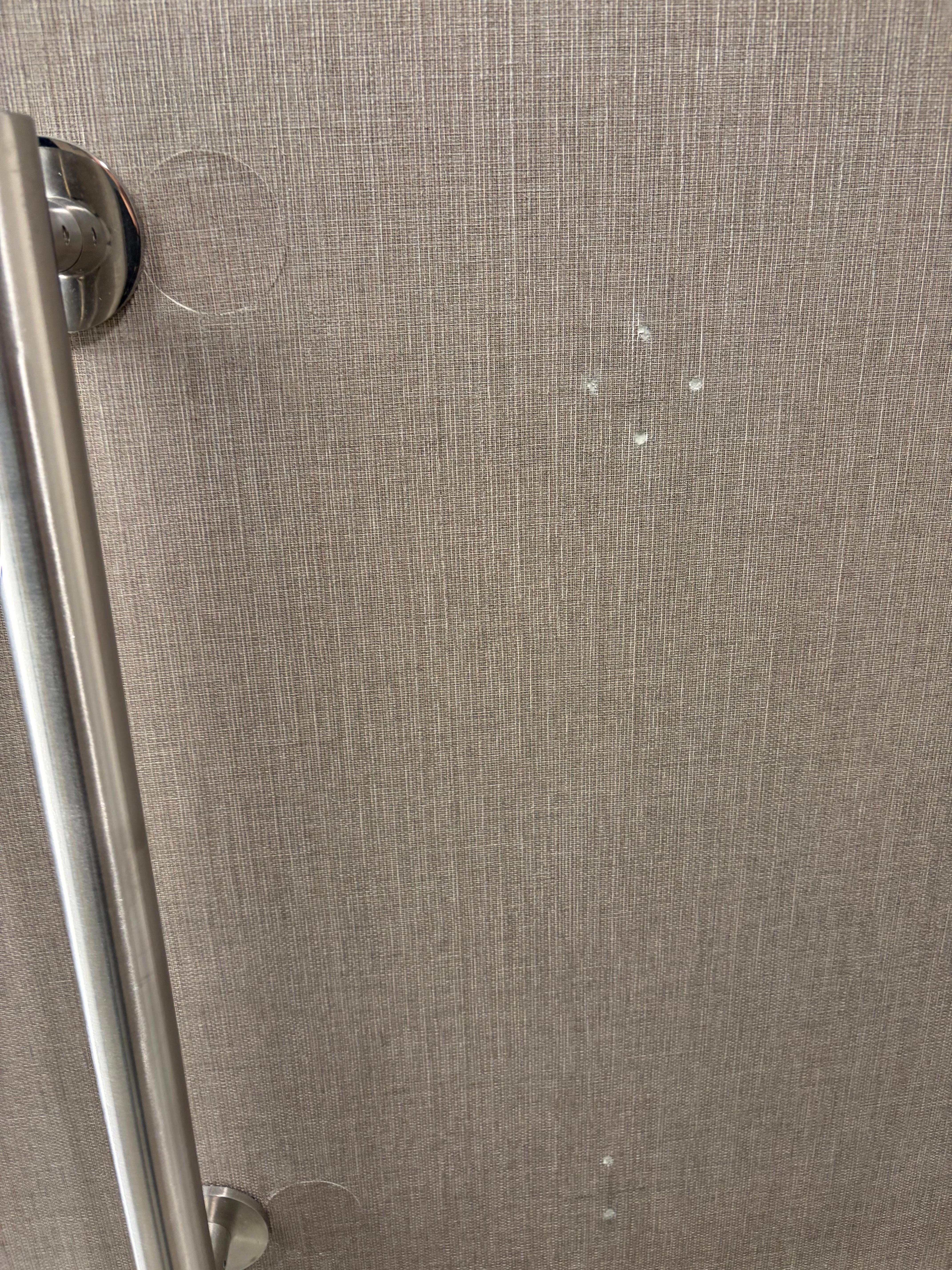 Just left the holes from when they attempted to put up the ADA handles. 