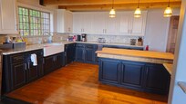 The kitchen is large with plenty of room to prepare meals. Plenty of dishware and kitchen tools and gadgets.