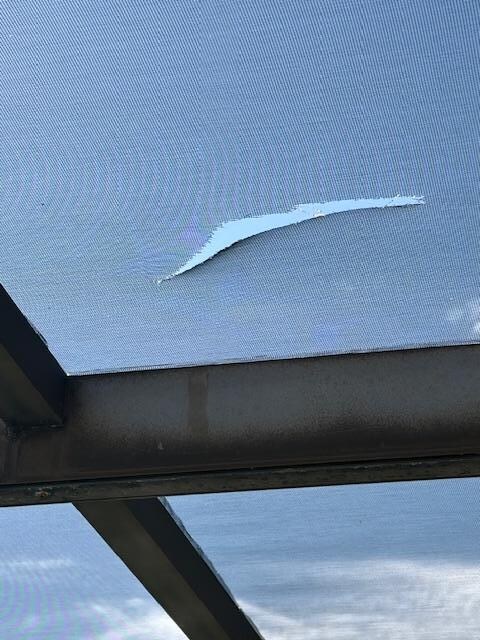 Pool area screen torn.