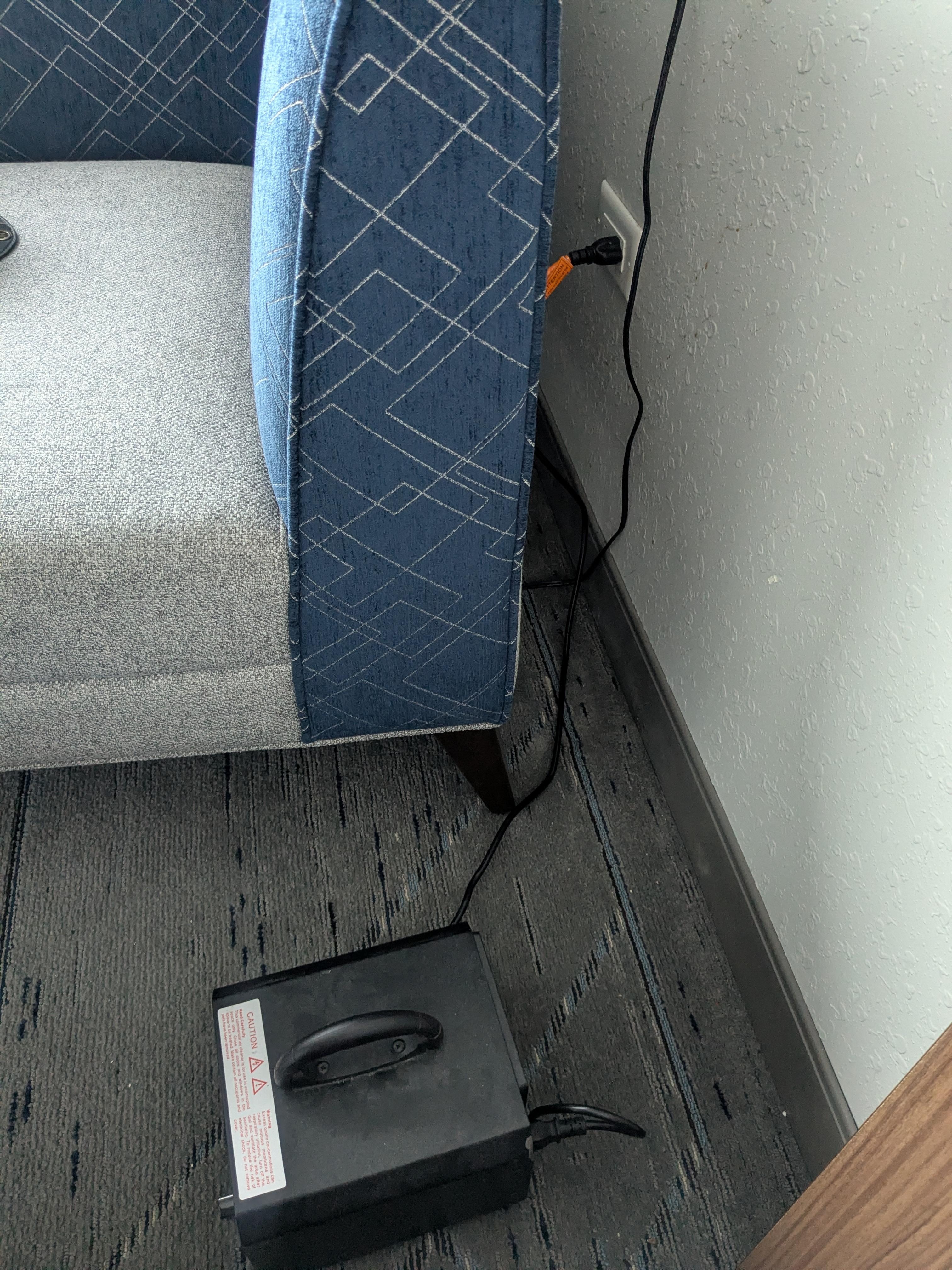 air filter next to the bed by the window