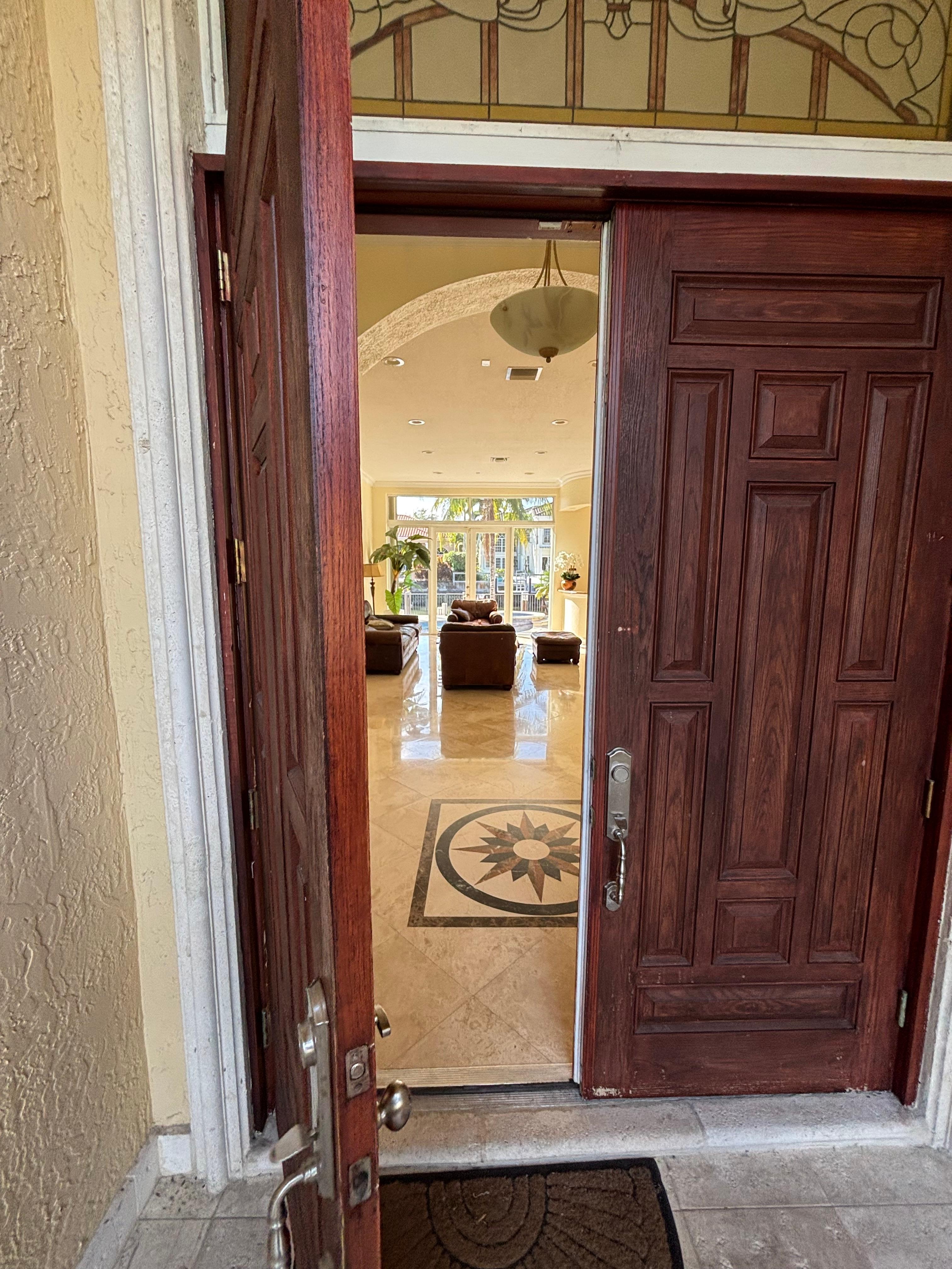Entrance looking in through the house to the pool