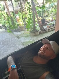 On one of the outside free standing hammocks