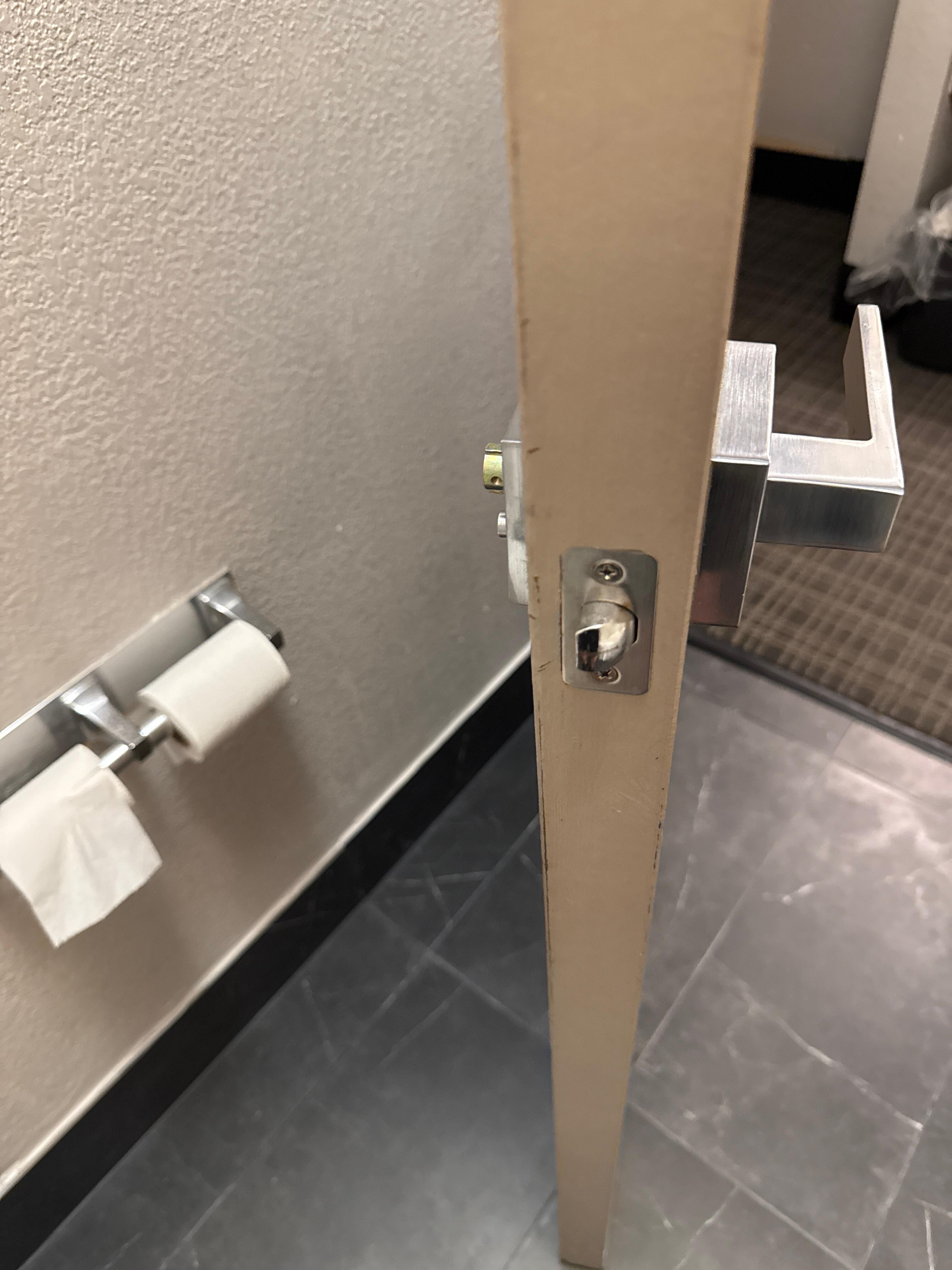 No handle inside bathroom = trapped. 