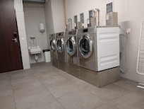 The front desk has tokens if you want to use the laundry equipment. Much cheaper than the actual laundry service. €3,50 each machine and there is a clothes line in the bathroom if they don't get all the way dry.