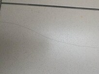 Multi cracks over floor tiles in bathroom