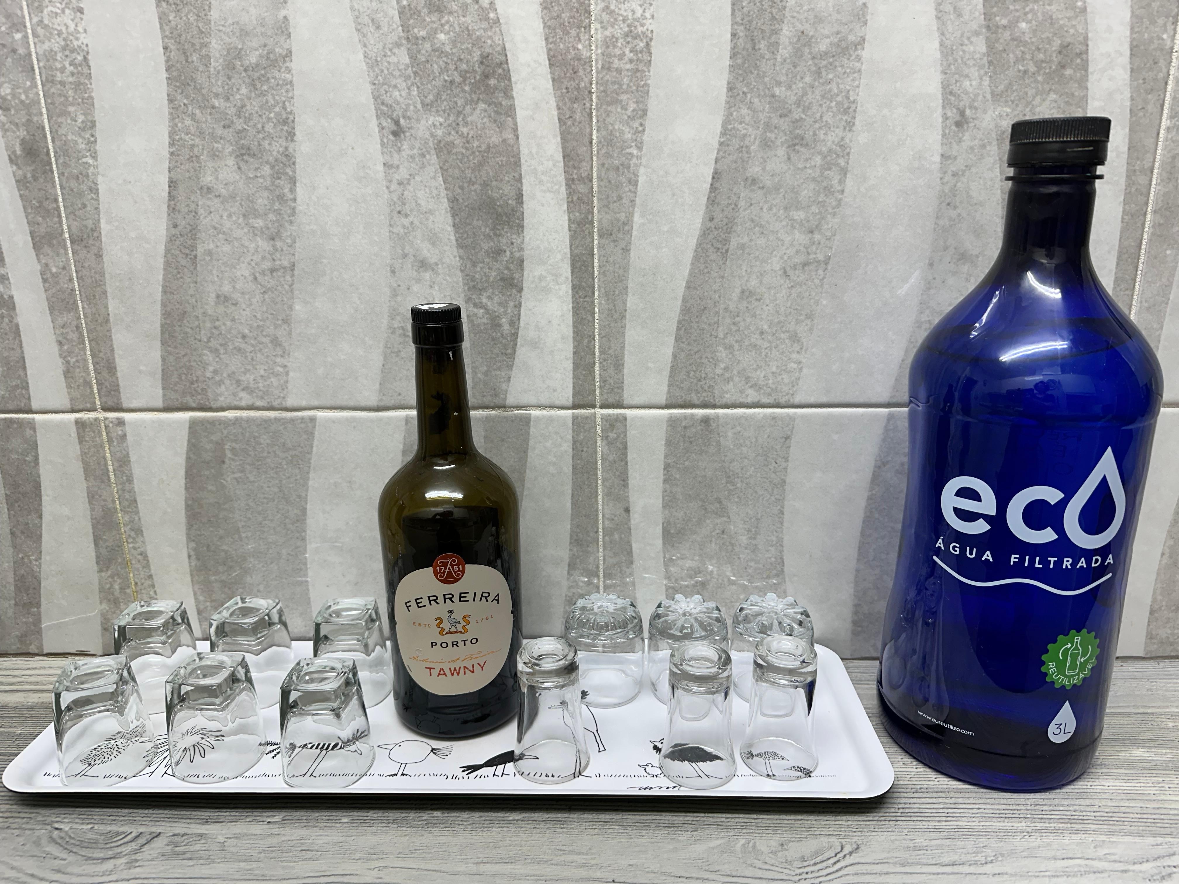 The shared kitchen is clean, with water and Port! 