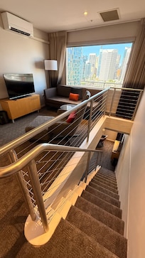 Landing with lounge , Tv , looking down the stairs