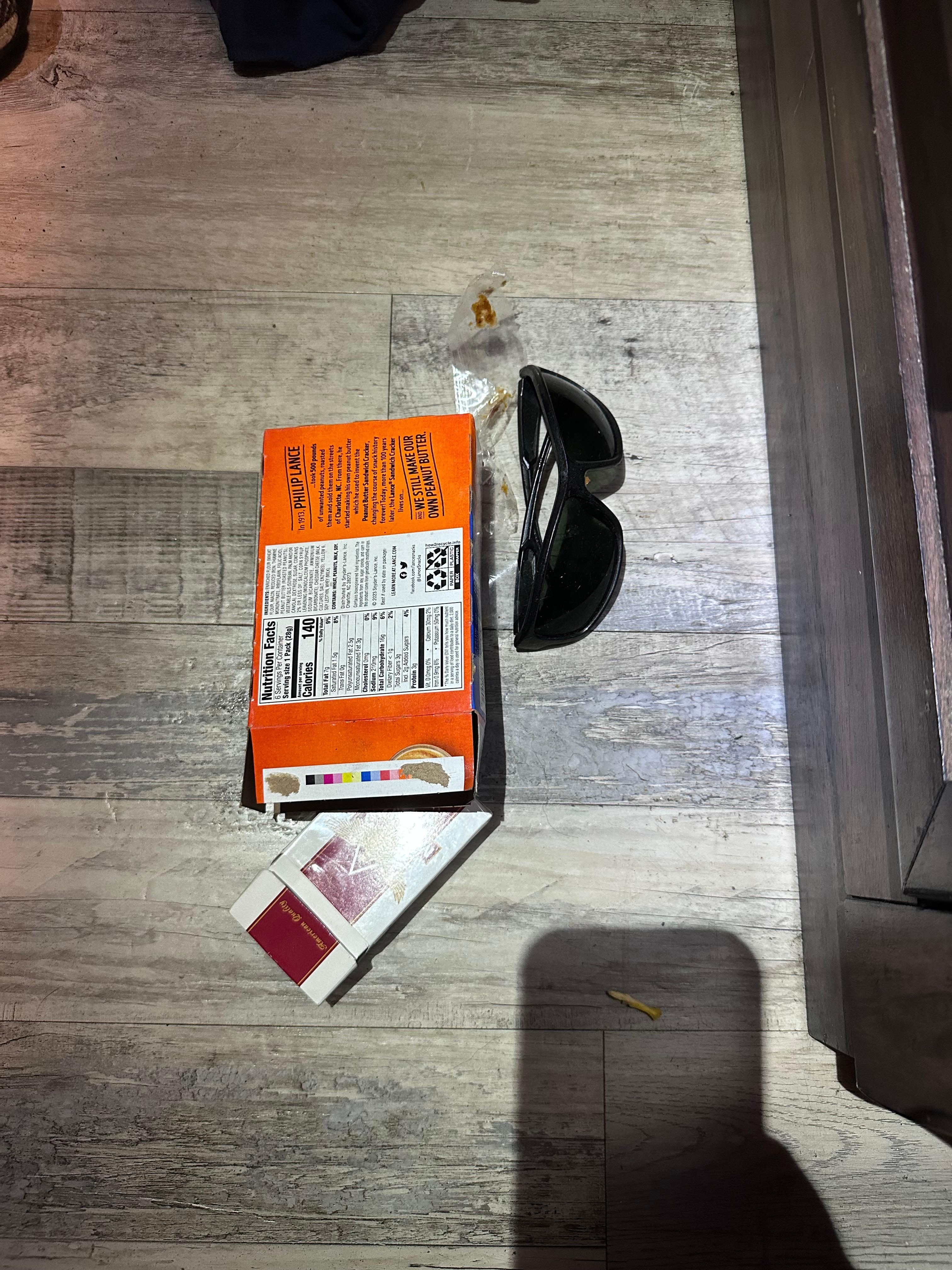 Trash found between nightstand and bef