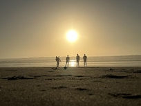 playing bocce ball at sunset in front of the house