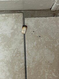 Cigarette butt on floor