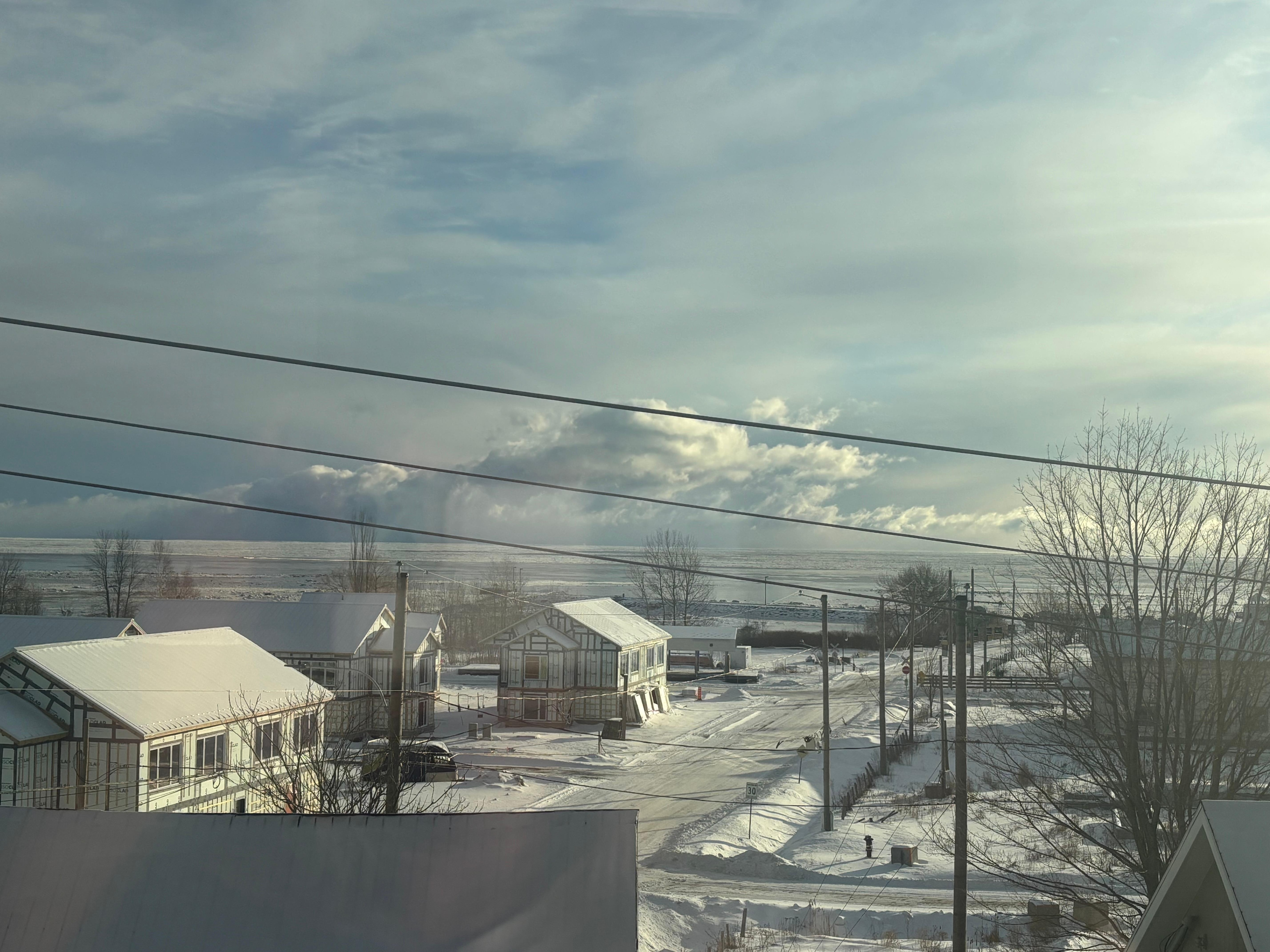 View from the window with frozen river 