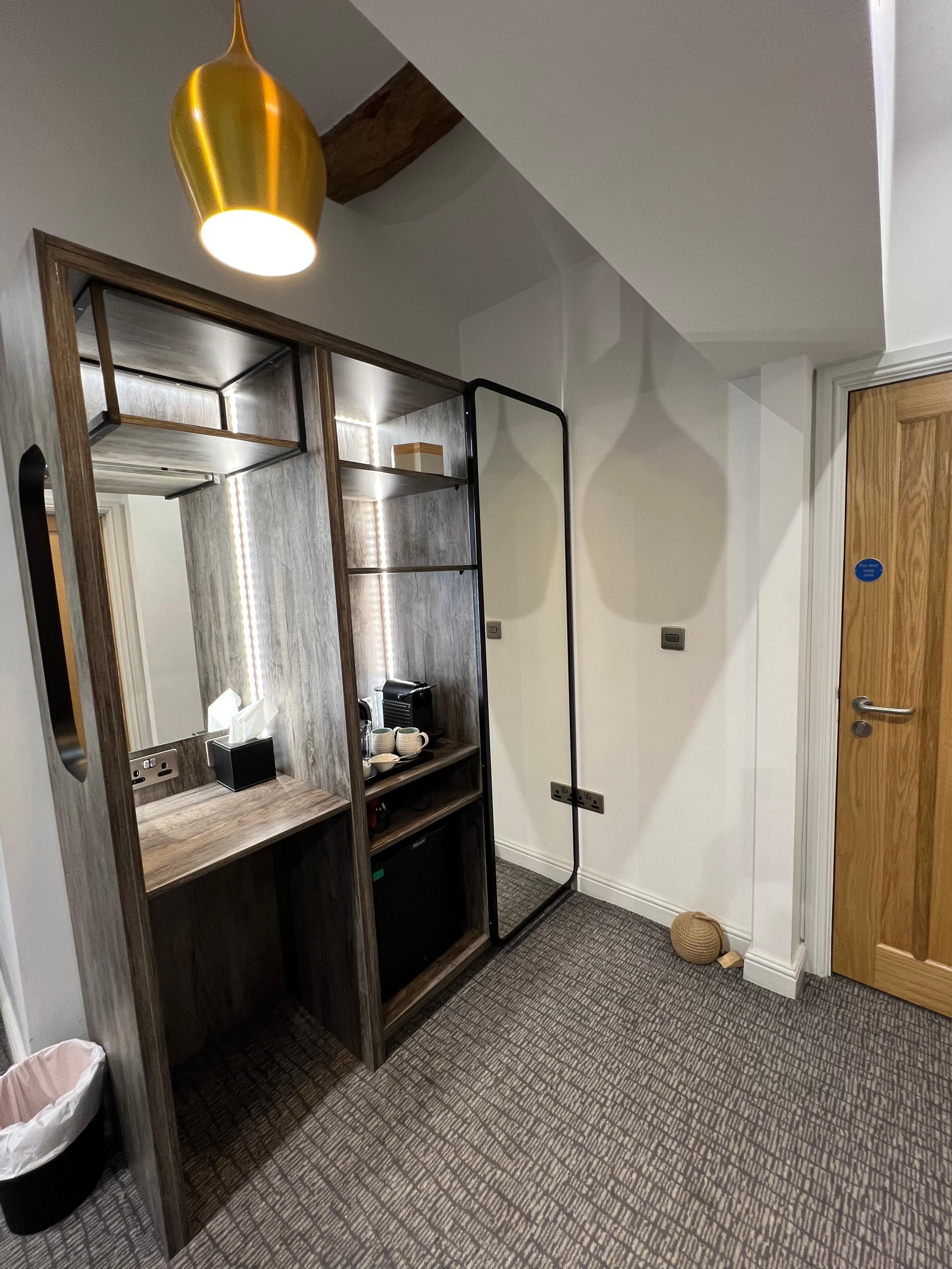 Warbrobe, fridge, coffee and tea facilities and somewhere to sit and get ready- very practical 