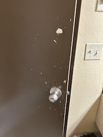 Chipped paint on bathroom door