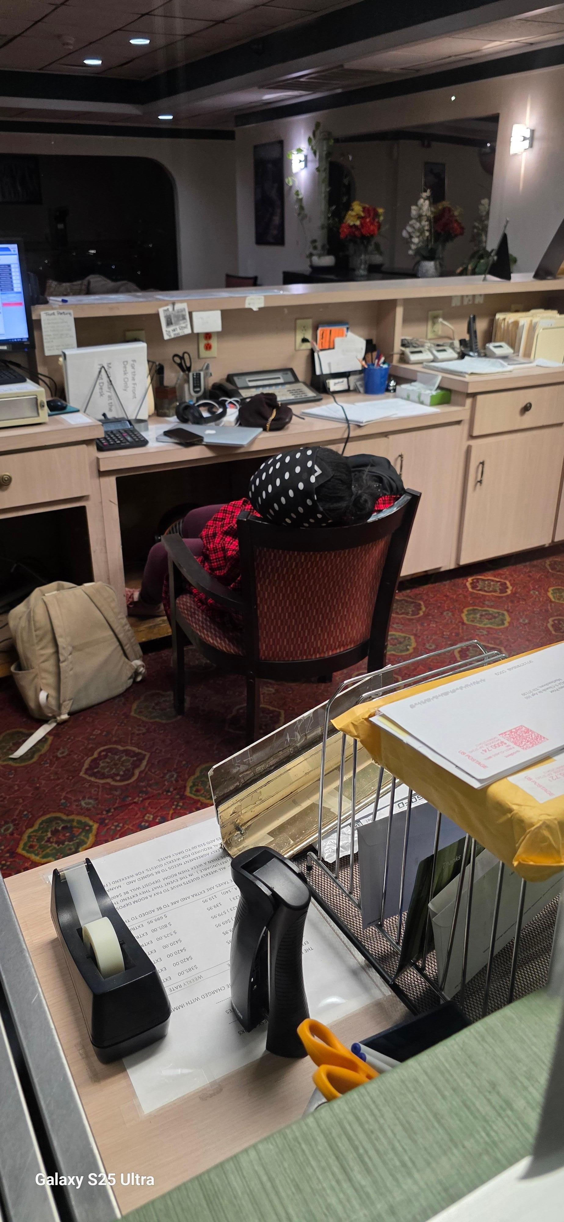 This is the clerk i'm trying to check out.She is sleeping in the chair.I rang the bell, she didn't move