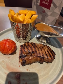 8oz sirloin steak done perfectly with a peppercorn sauce, I ate my mushroom before I took the picture. All really delicious 😋