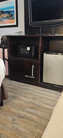 Broken dresser with one screw.
