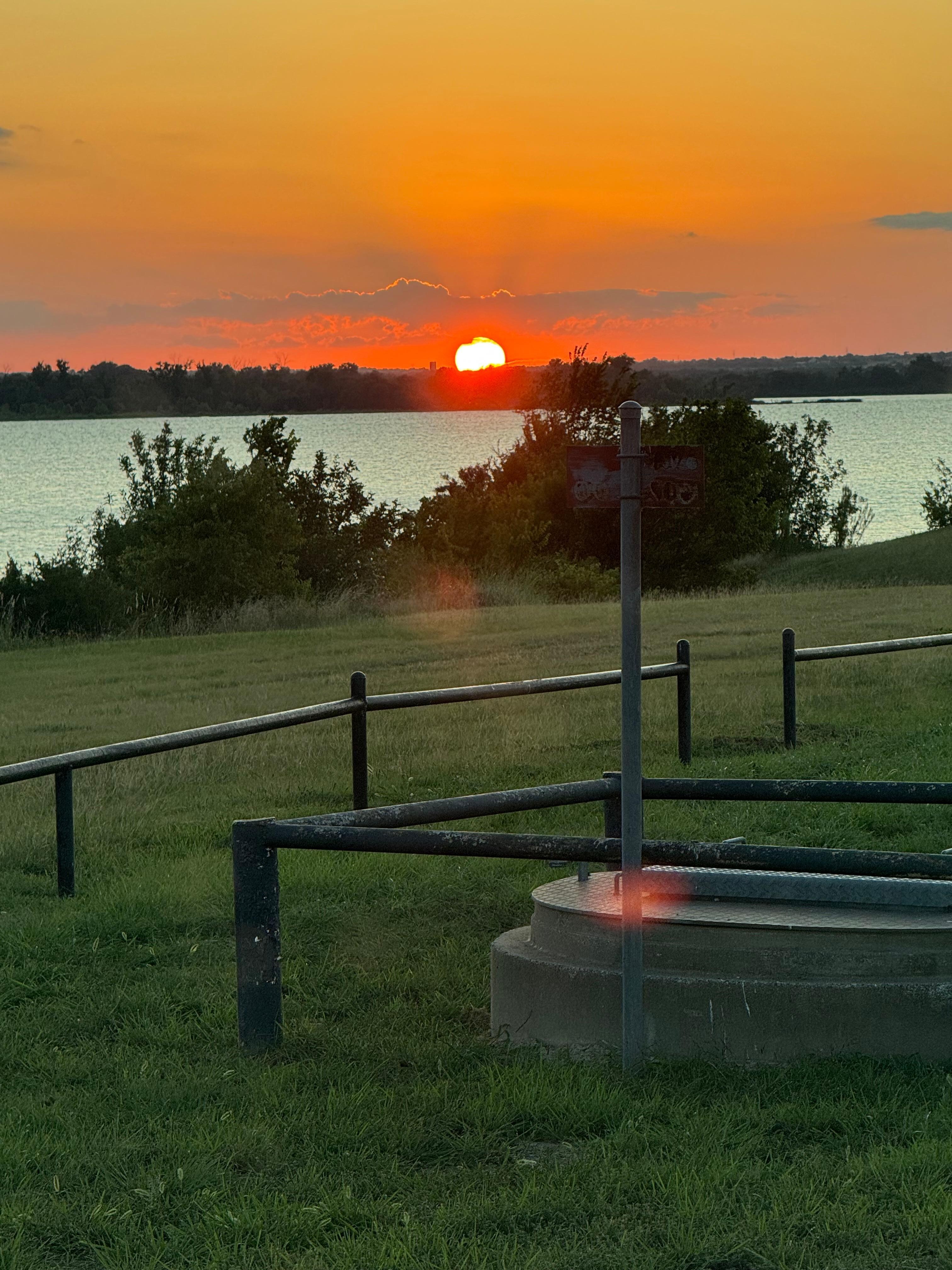 Sunset over Lake Pat Cleburne from our RV. 