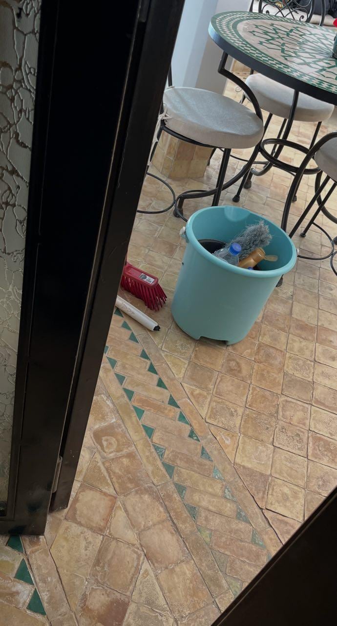 Cleaning bucket left in front of our door, asking us to vacate the room.
