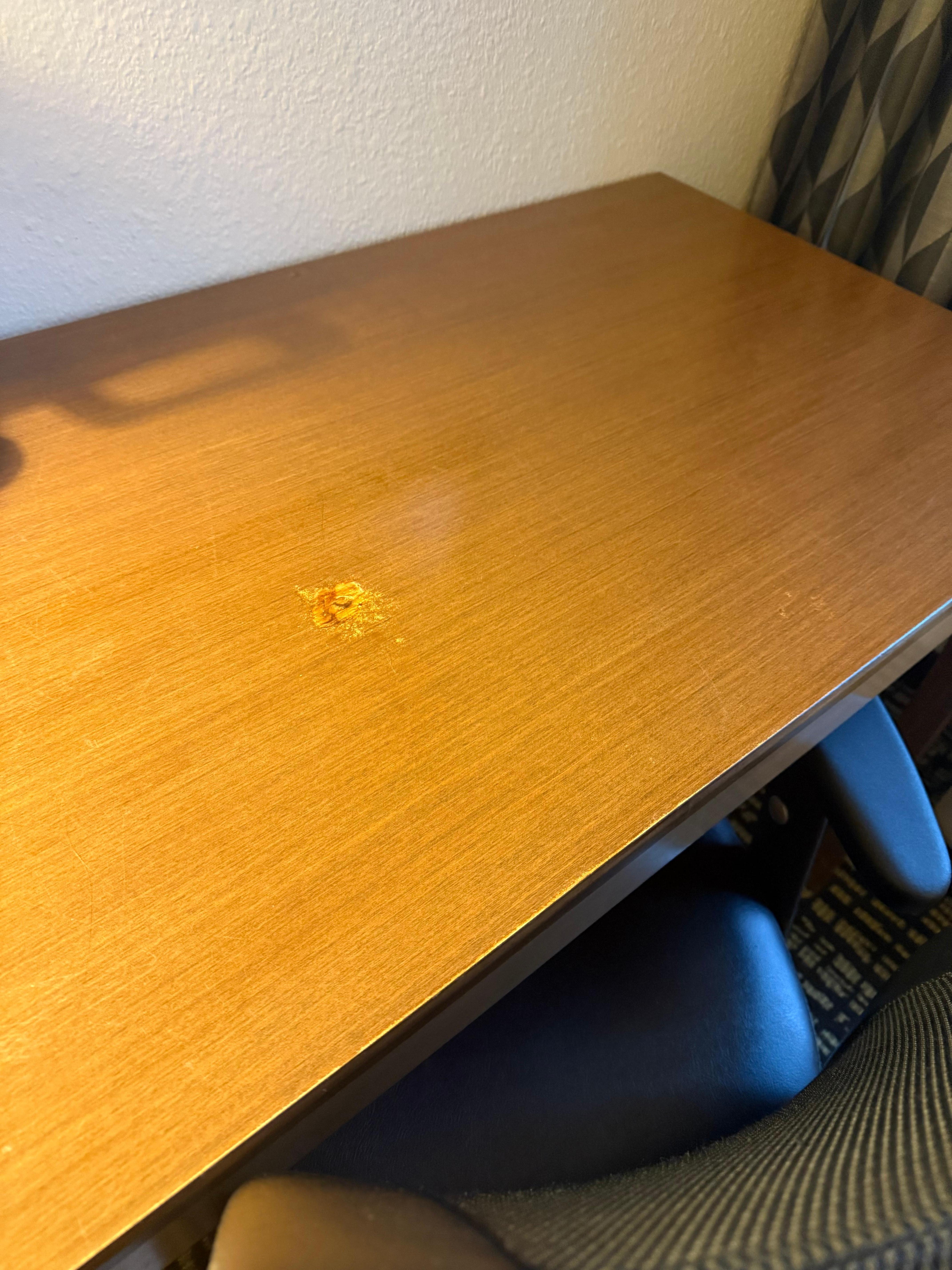 Finish worn off desk. Vanity in bathroom was similar 