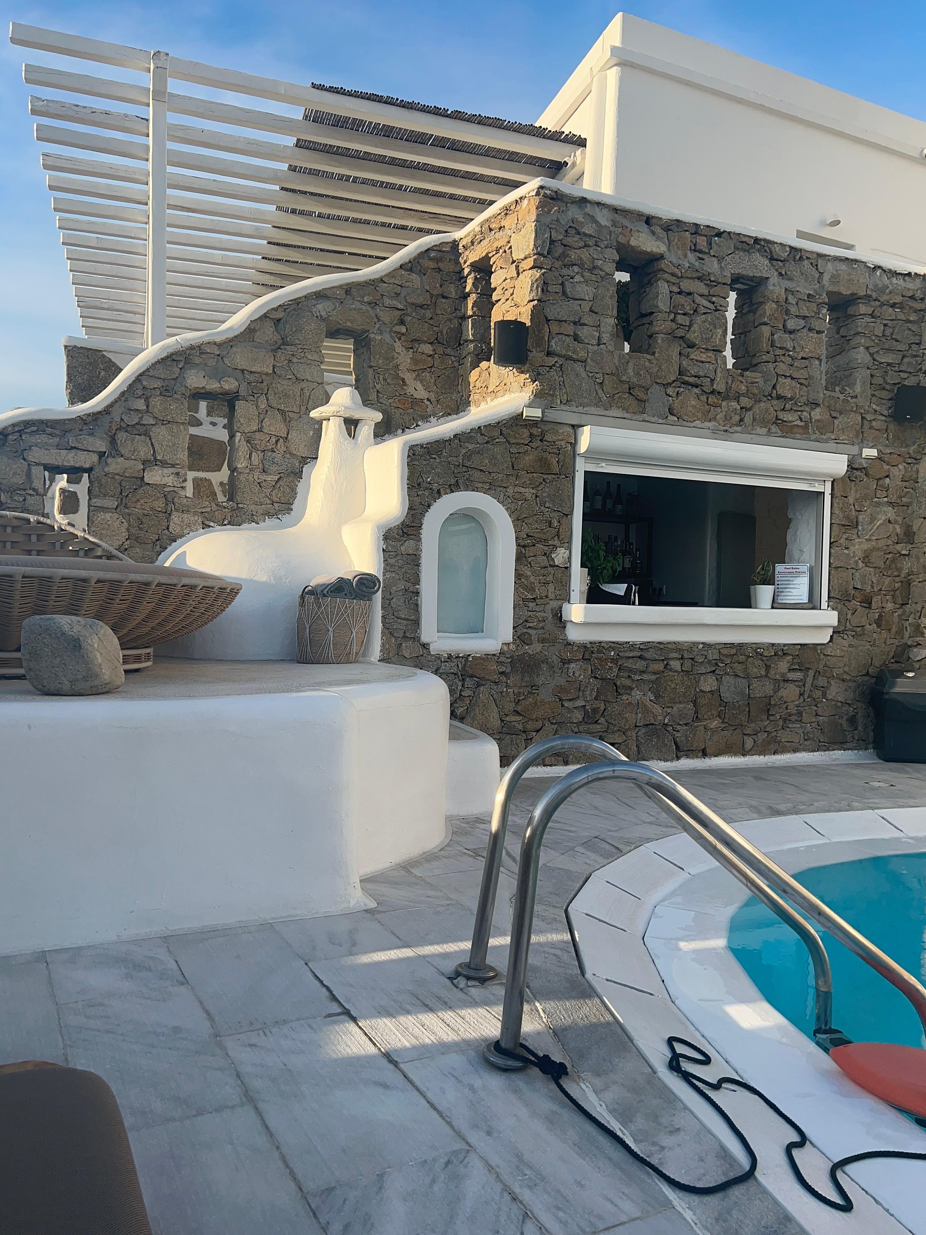 The pool bar and one upper lounging area