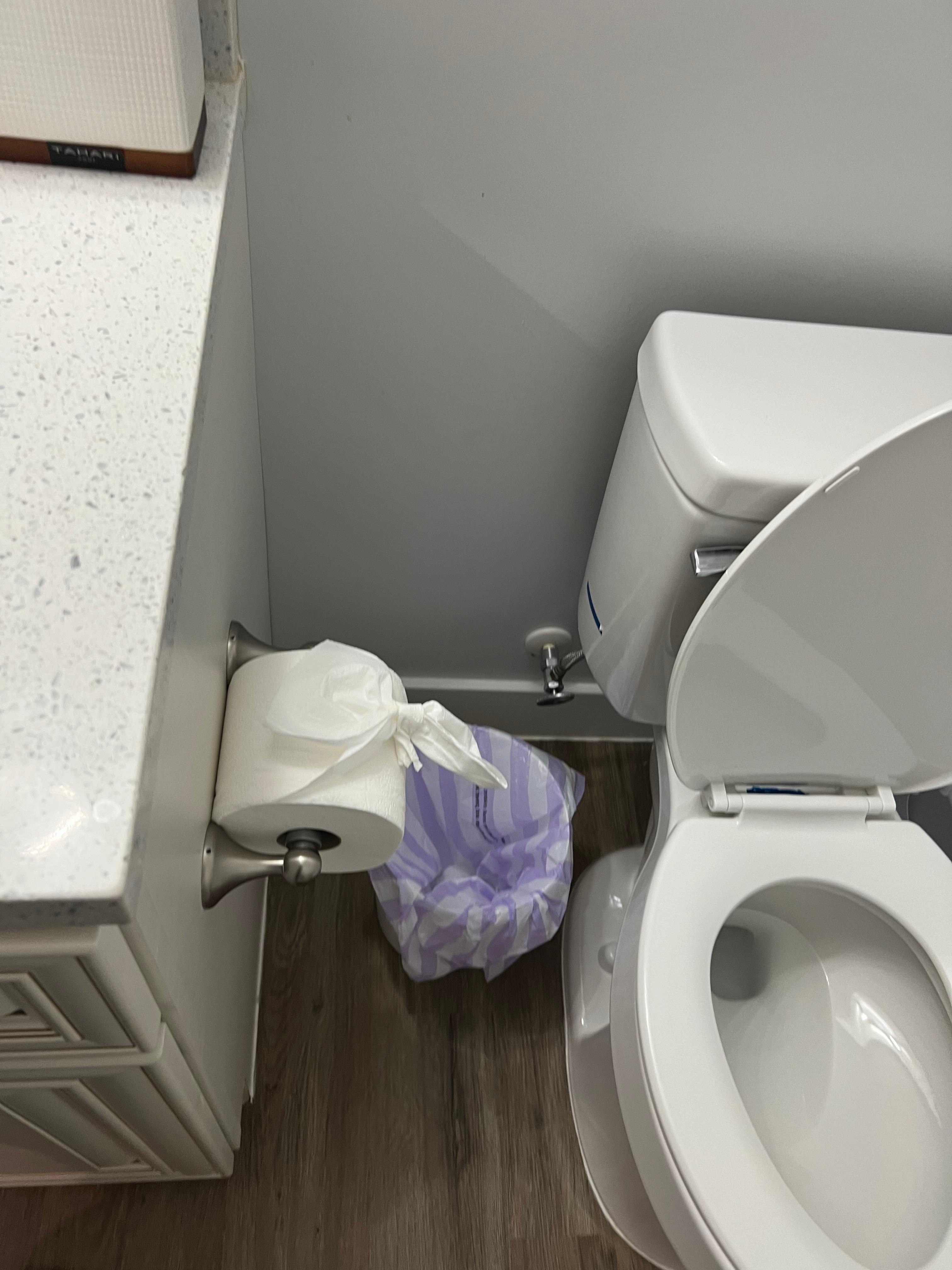 Decorative toilet paper in every bathroom you cant use; pre-dampened to the cardboard make the bow stick/set 