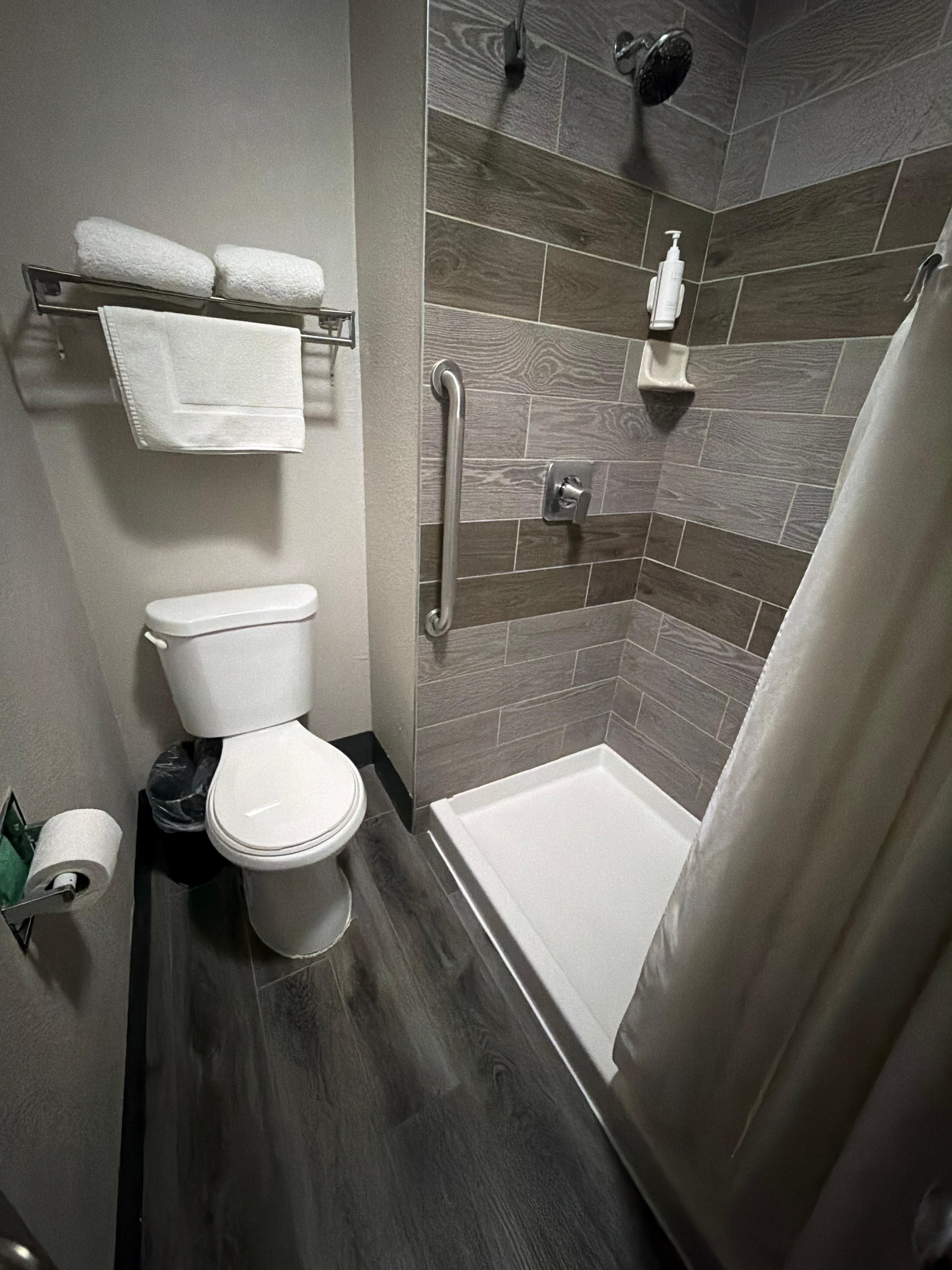 Bathroom very cramped and toilet inches from shower and curtains won’t stay in shower area.