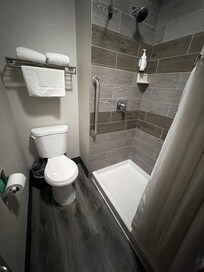 Bathroom very cramped and toilet inches from shower and curtains won’t stay in shower area.