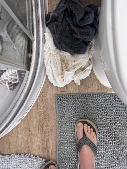 Dirty towel owner left while fixing leak.