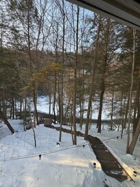 View from window down to the half frozen creek