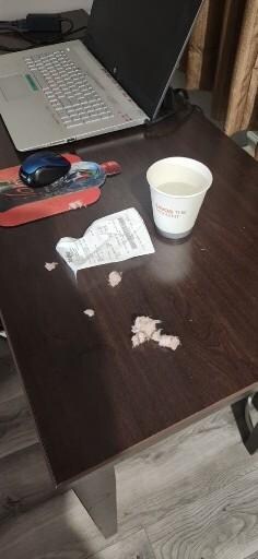 Insulation in my drink. Fron an open electrical box in the ceiling. I drank from it before I seen it. I hope I make it home before I get sick.
