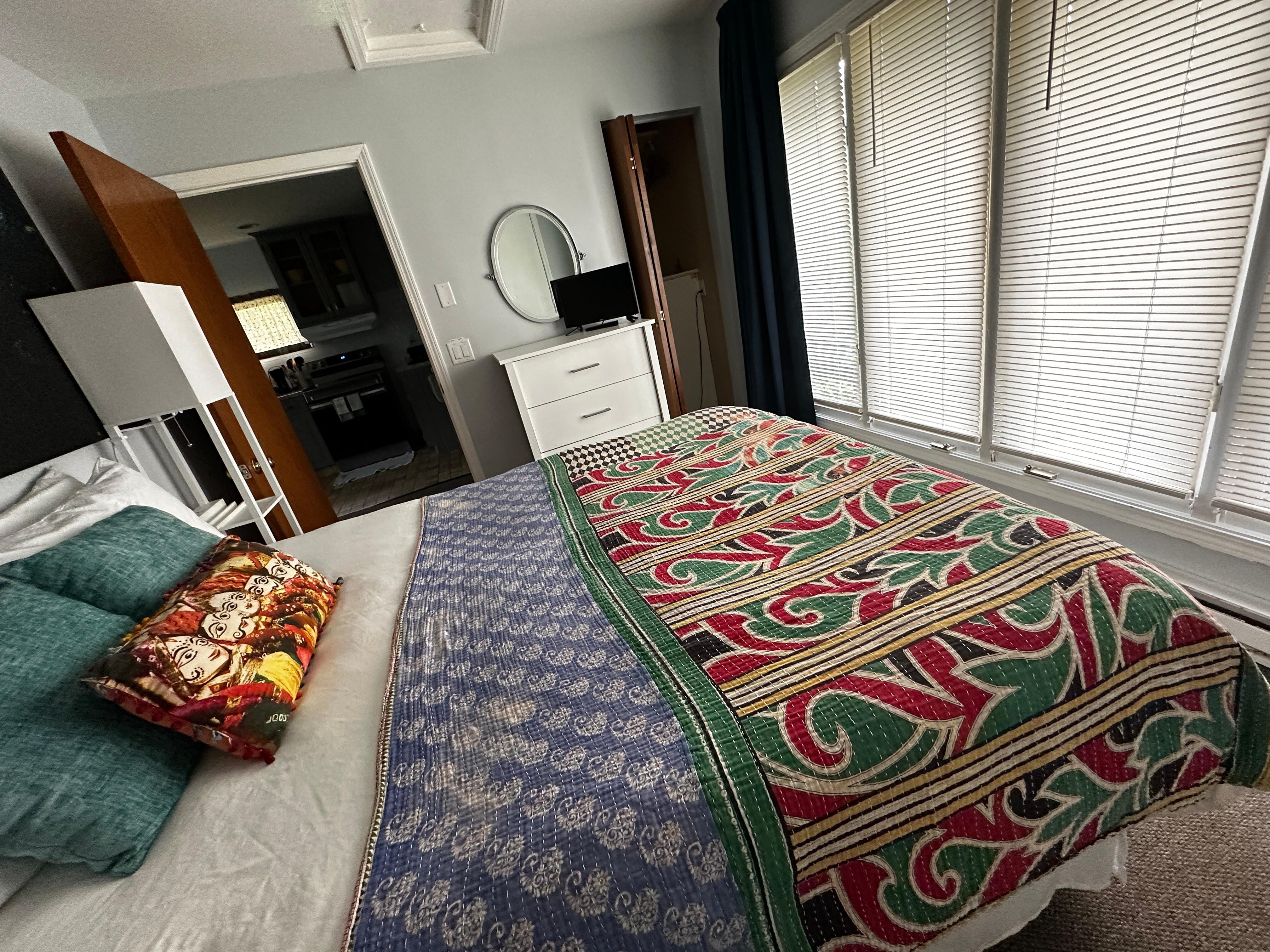 Comfortable bed with private entrance to patio