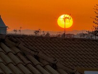 O lindo pôr do sol do terraço