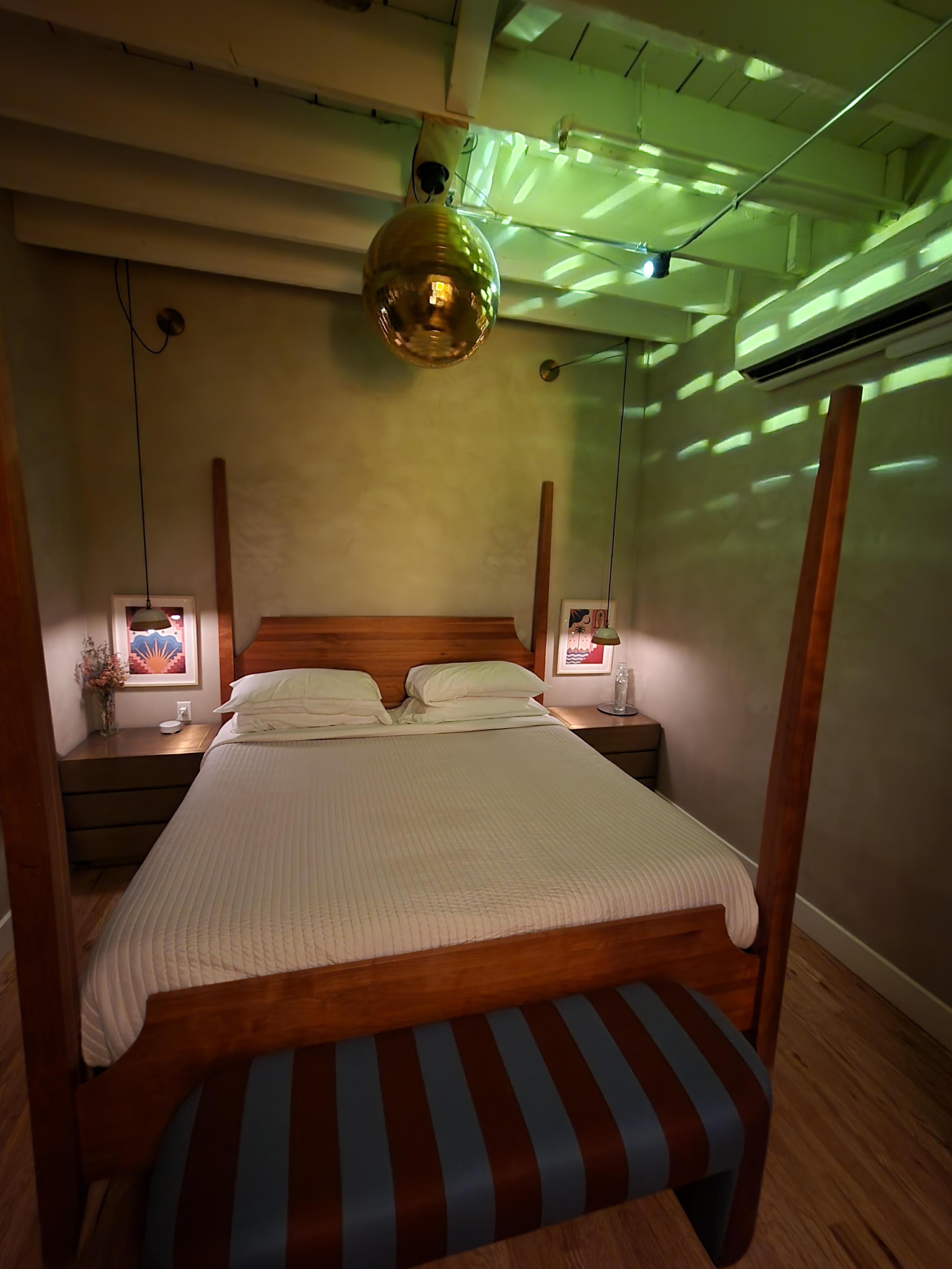 The disco ball above the bed is a nice touch