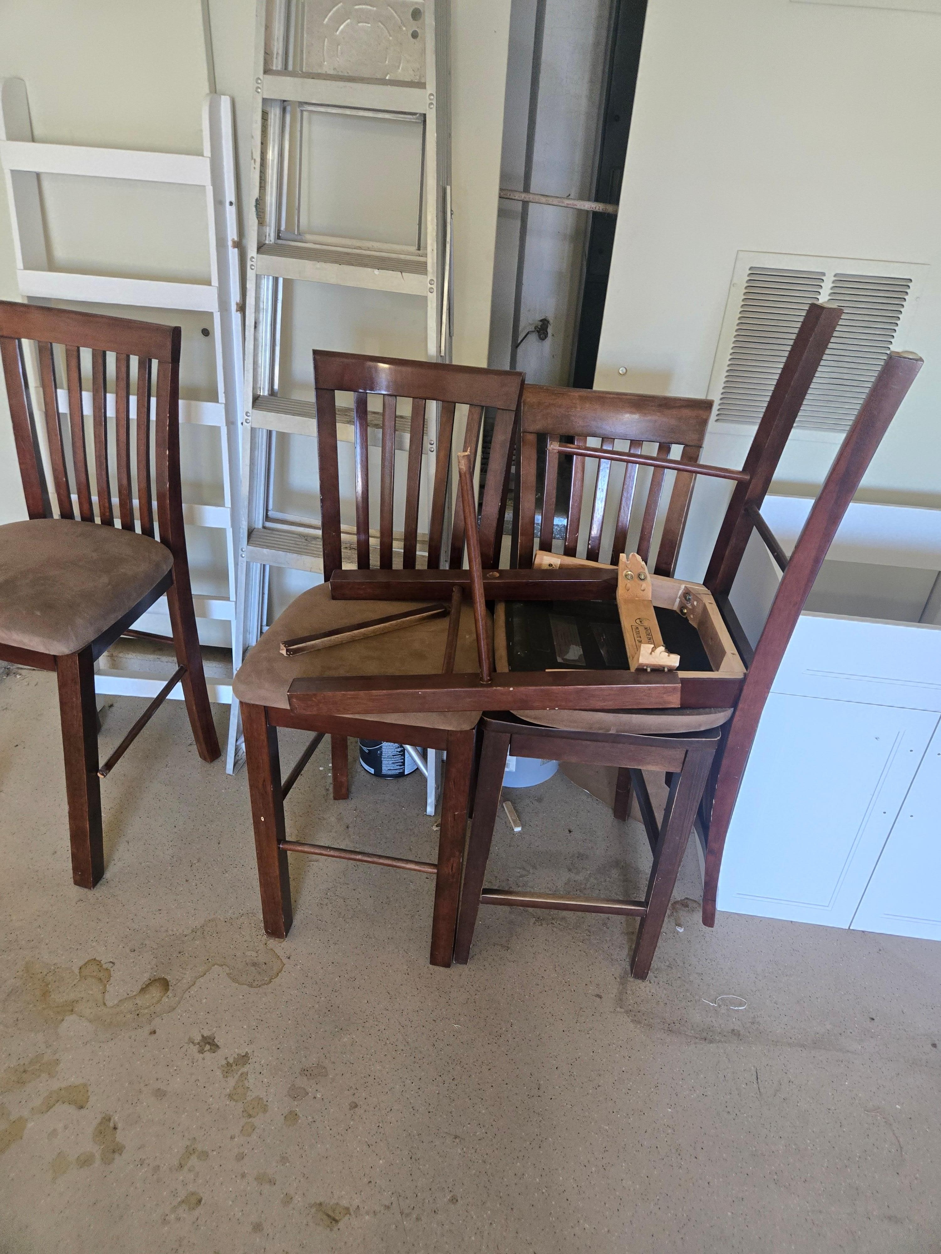 Broken chairs in garage that apparently never replaced, just removed from house.