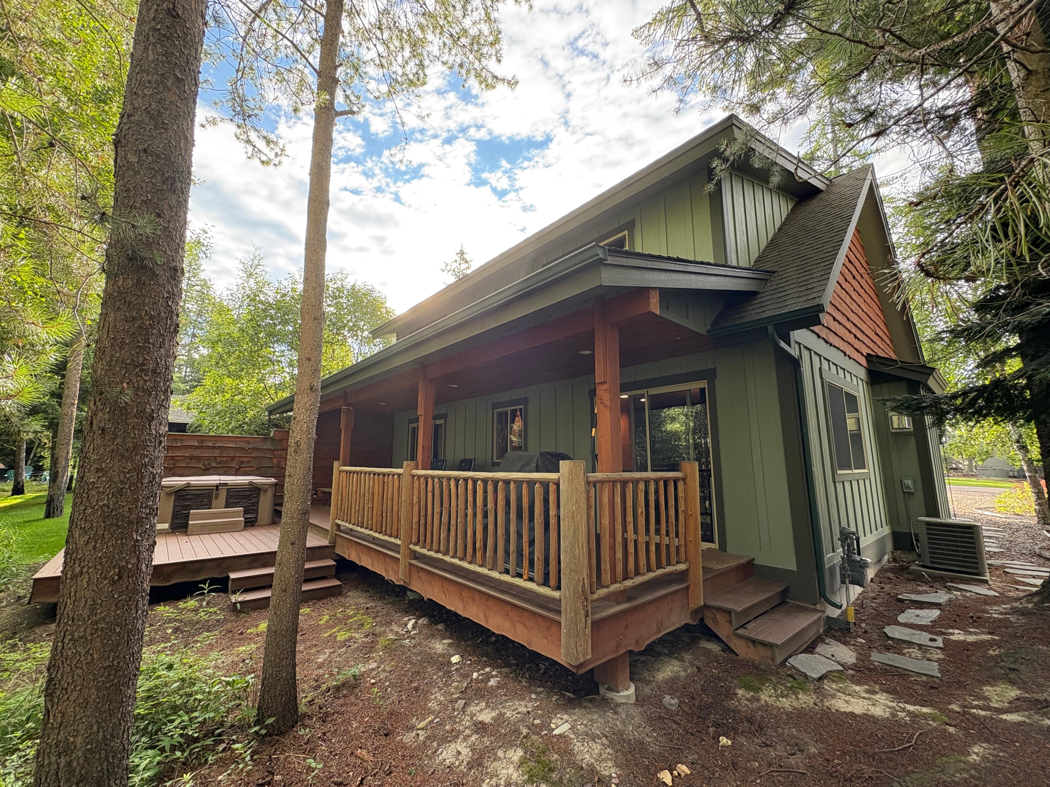 Inviting back porch with hot tub; perfect after long hikes in the Park.