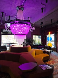 Main lobby with a huge chandelier hung very low.