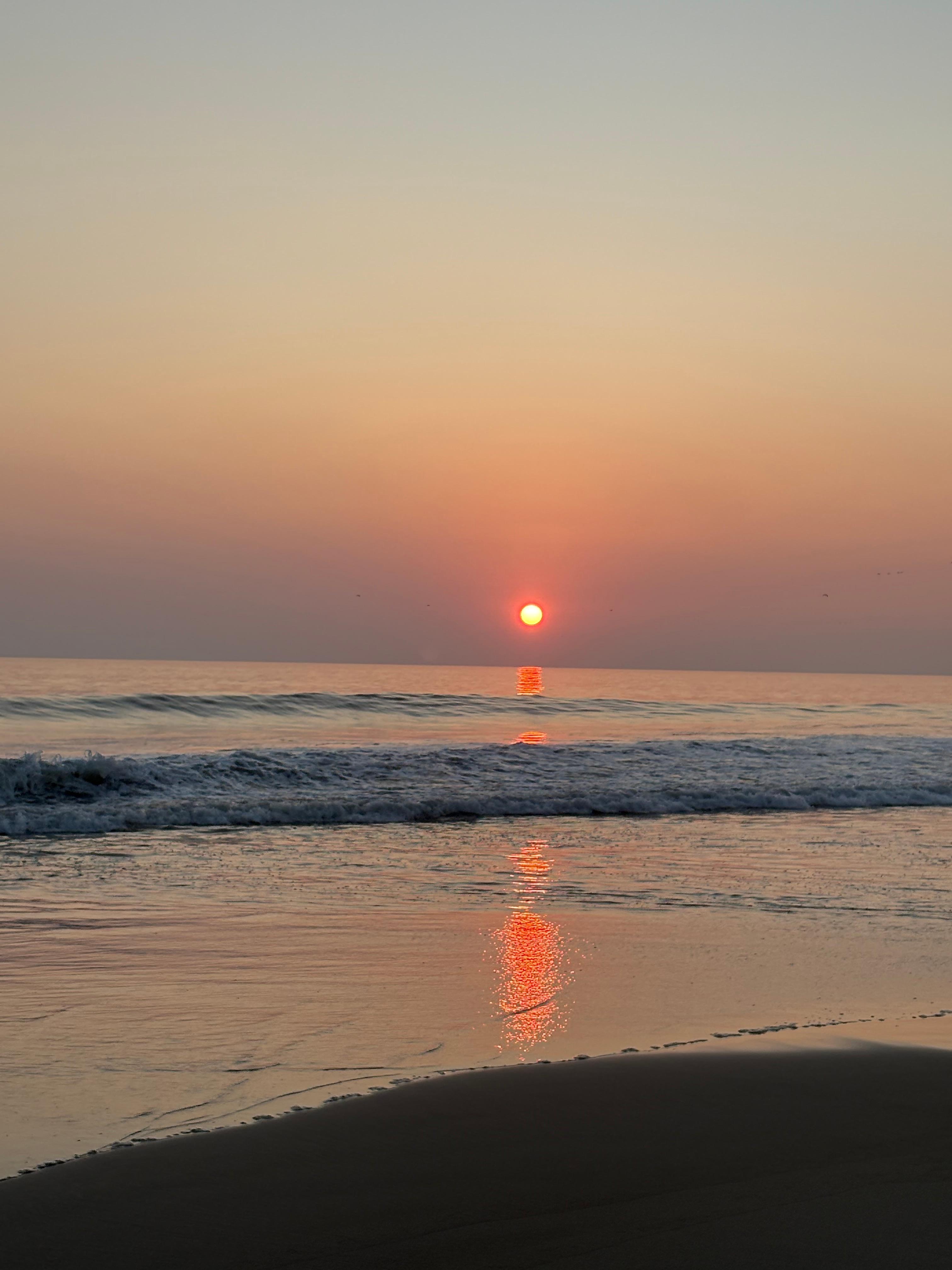 Sunset on the beach in front of the house.