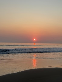 Sunset on the beach in front of the house.